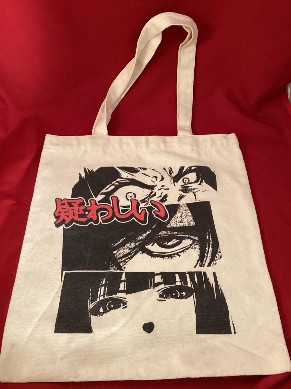 White Canvas tote bag with black Junji Ito Horror Manga and Red Text